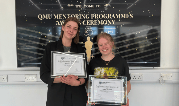 Mentor and mentee holding their Employer Mentoring Programme Awards 
