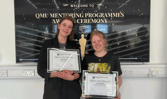 Mentor and mentee holding their Employer Mentoring Programme Awards 