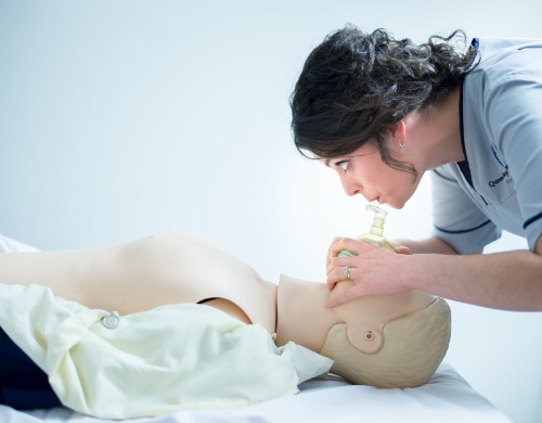 Health professions student administering care