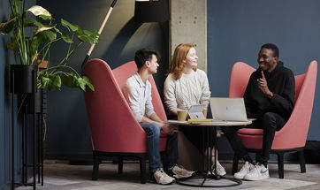 Business colleagues sitting around a table chatting