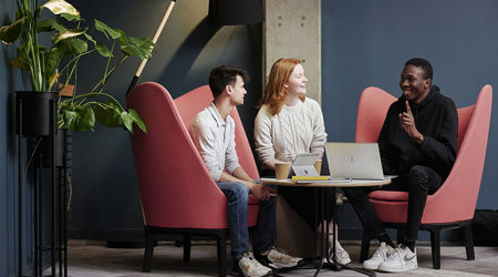 Business colleagues sitting around a table chatting
