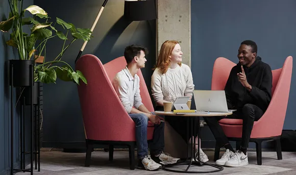 Business colleagues sitting around a table chatting