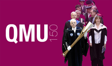 A standard banner with the QMU Logo and the text "QMU150" alongside a group of people in procession, one holding the university mace.