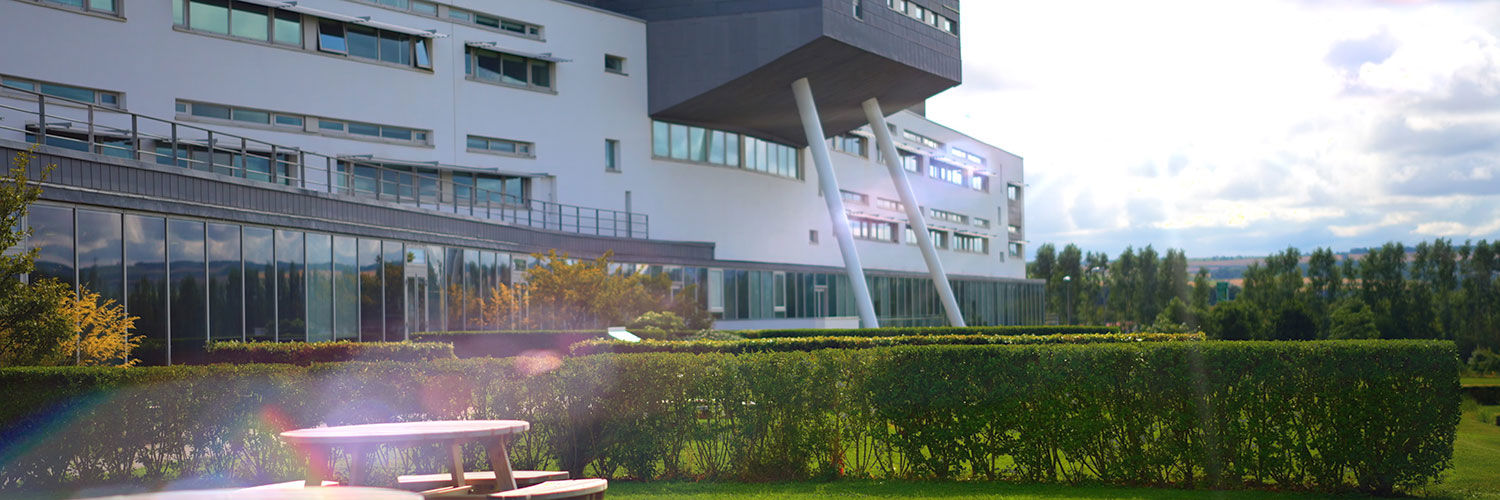 Table at QMU Terraces with backdrop of main QMU building