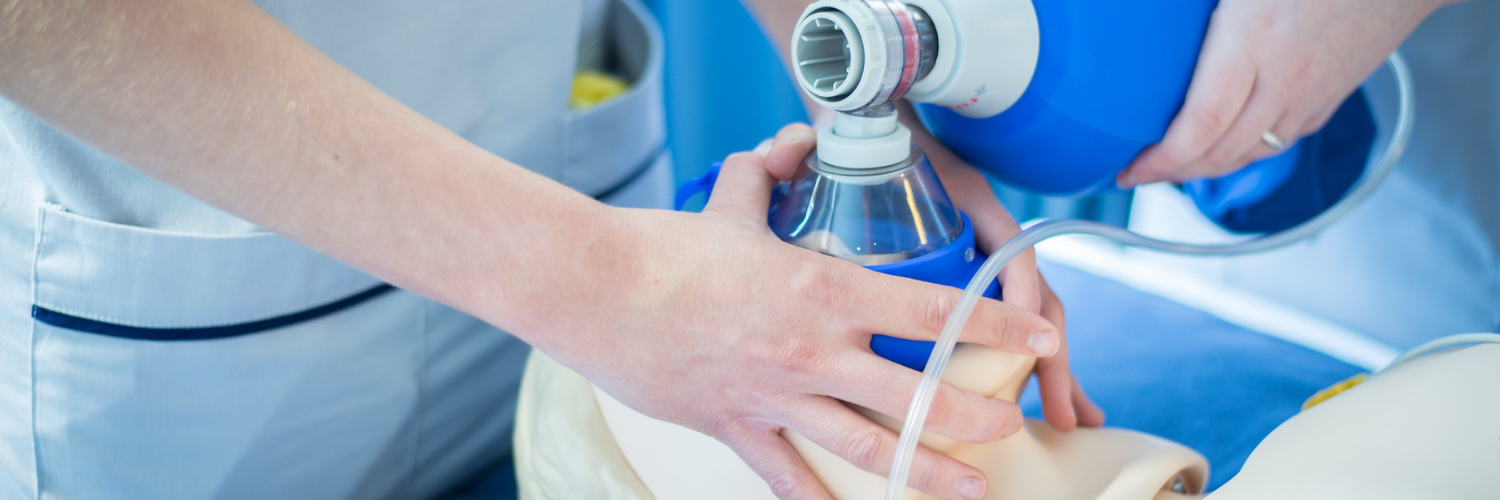 Nurses at Queen Margaret University practice administering oxygen to a test dummy.