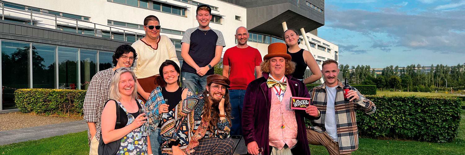 A group of Edinburgh Fringe performers outside of the QMU main building.