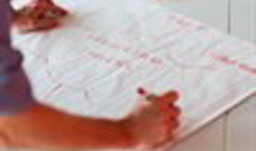 Person creating a spider diagram with ideas relating to leadership