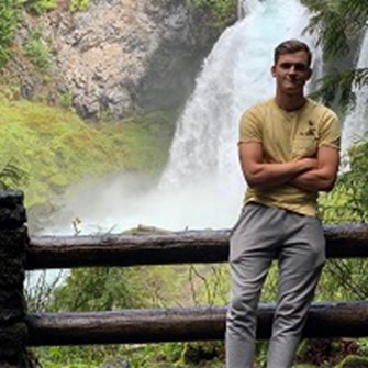 Image of Ignas at a waterfall
