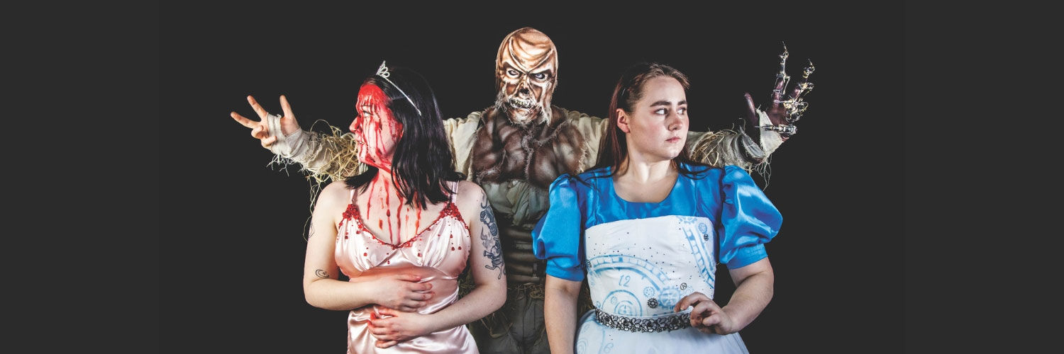 A group of students in costume, performing at the costume showcase.