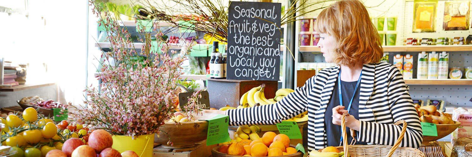 A woman shopping in an organic fruit and vegetable store