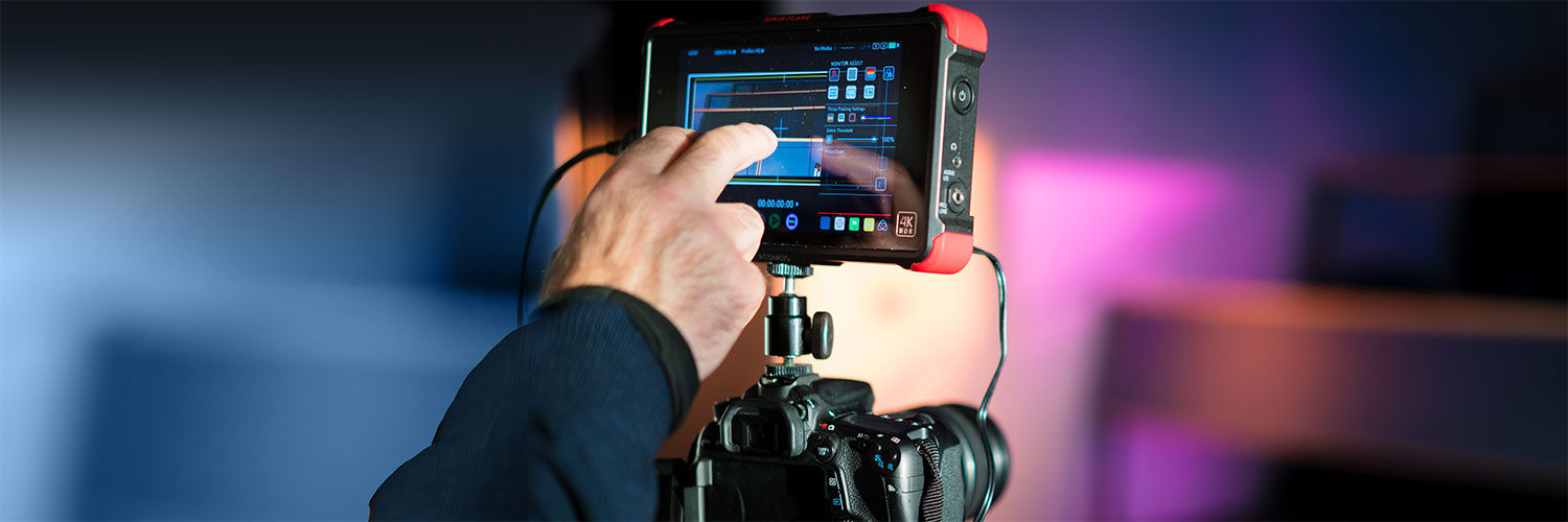 Close up of a high end digital camera with a touch screen for editing