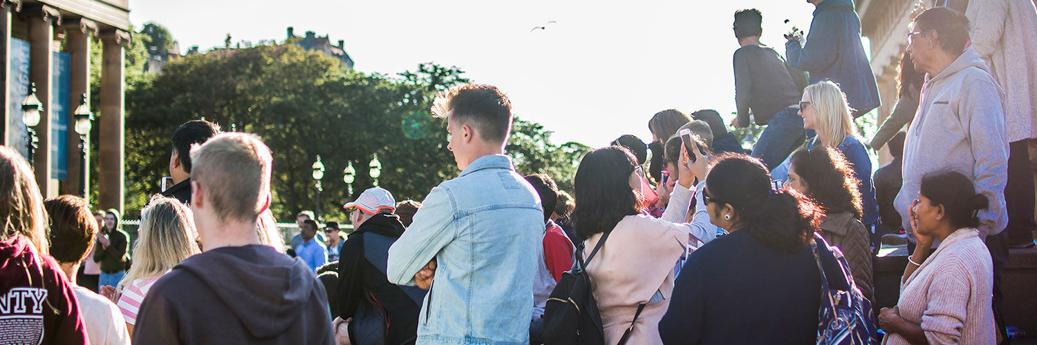 People watching street performance in Edinburgh 