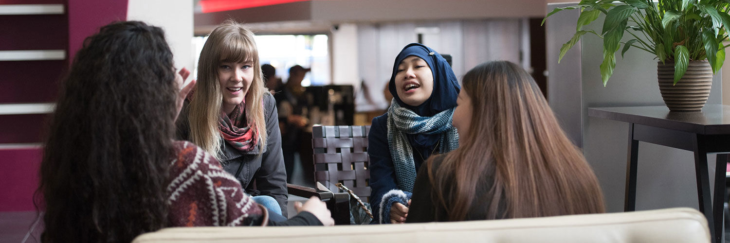 Friends of different ethnicities laughing together