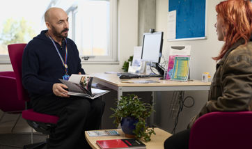 Career advisor helping female student