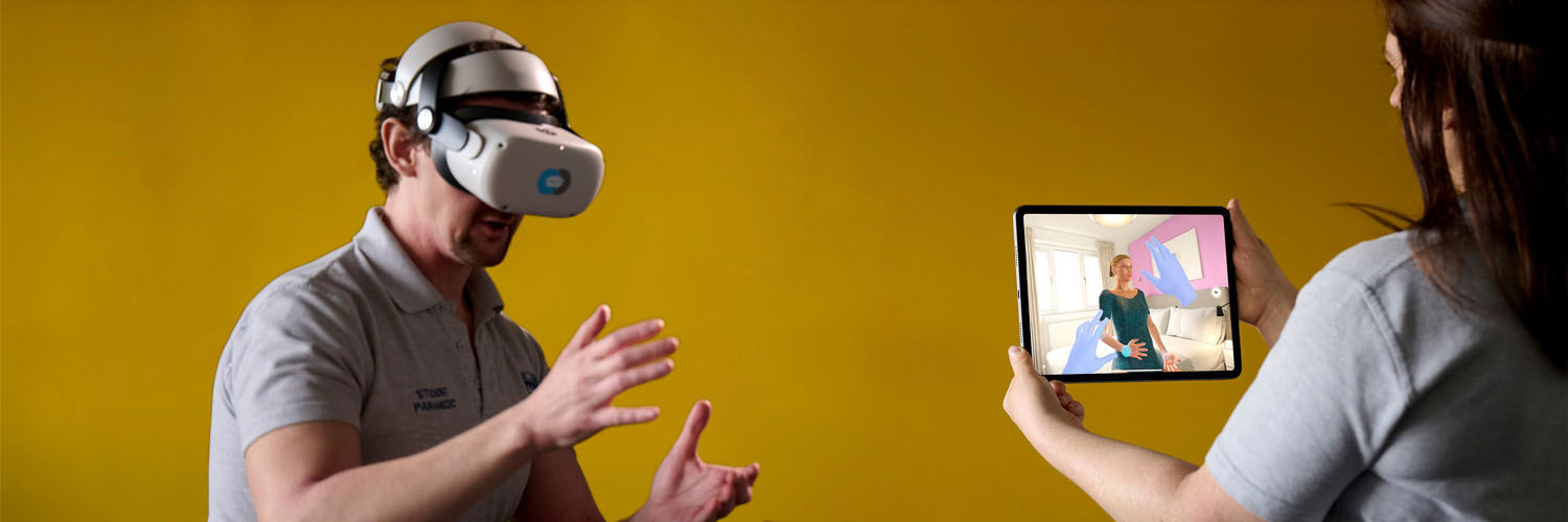 Two paramedic science students demonstrating the use of VR technology in learning 
