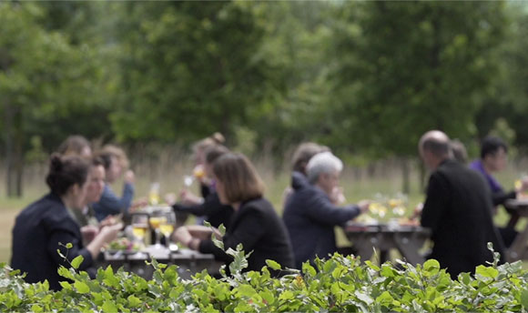 A group of people dining outdoors.