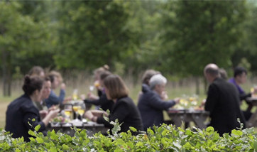 A group of people dining outdoors.