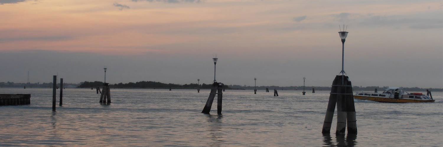 A seafront at dusk.