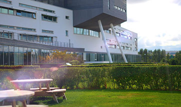 Dining tables at QMU Terraces with QMU main building in backdrop