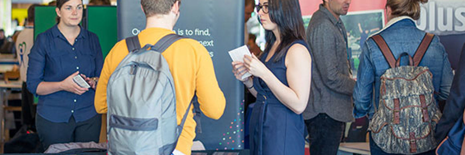 A group of students at a fair in Queen Margaret University, Edinburgh
