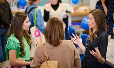 Student talking to a member of QMU staff