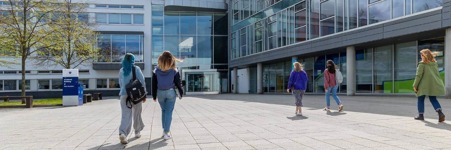 Two students outside of QMU campus