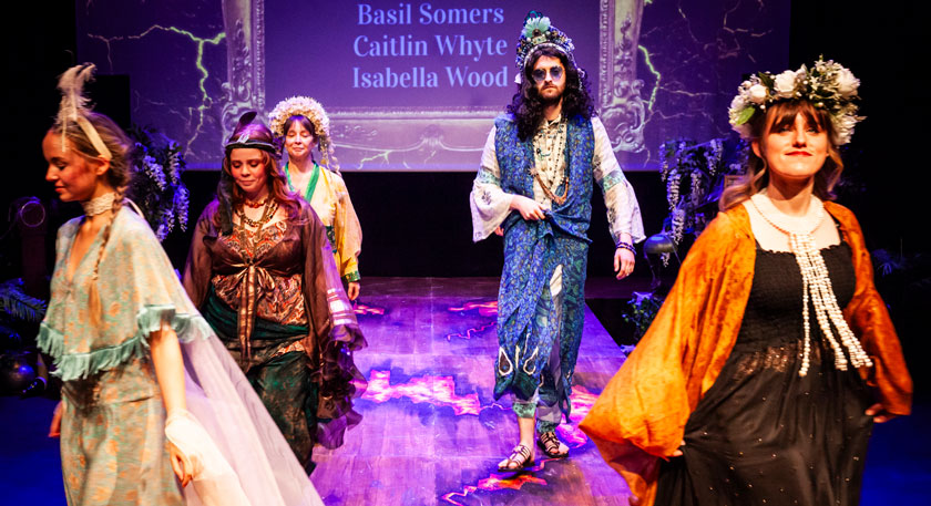 Students on stage in costumes