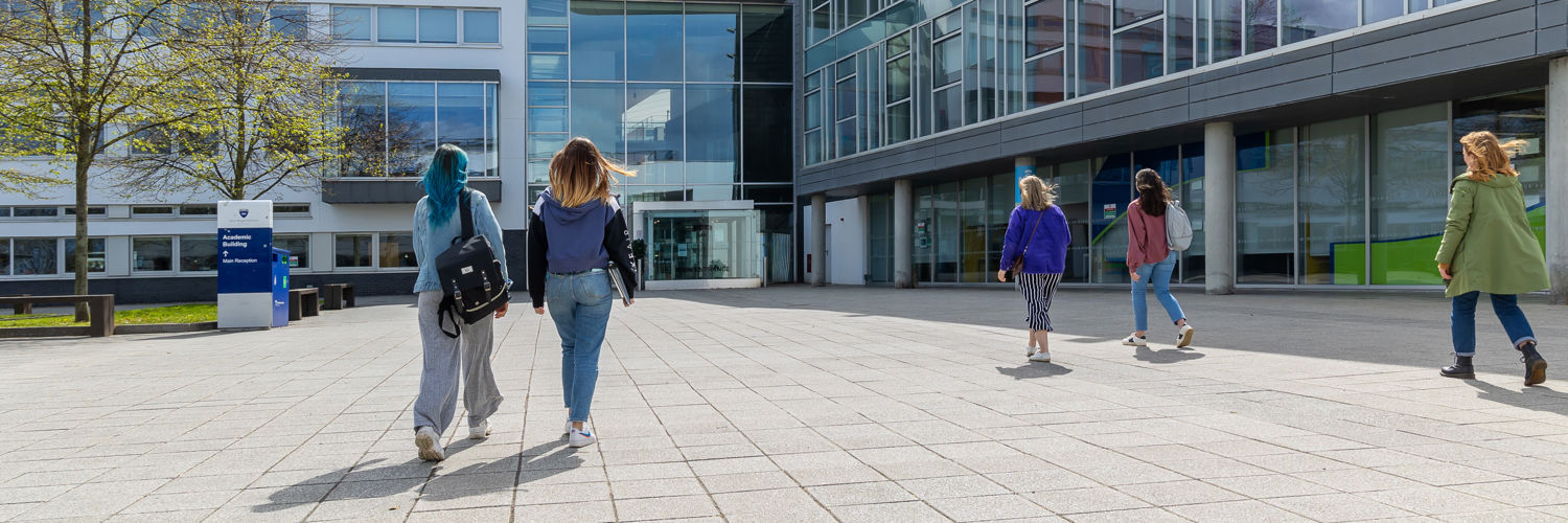 Students walking into campus