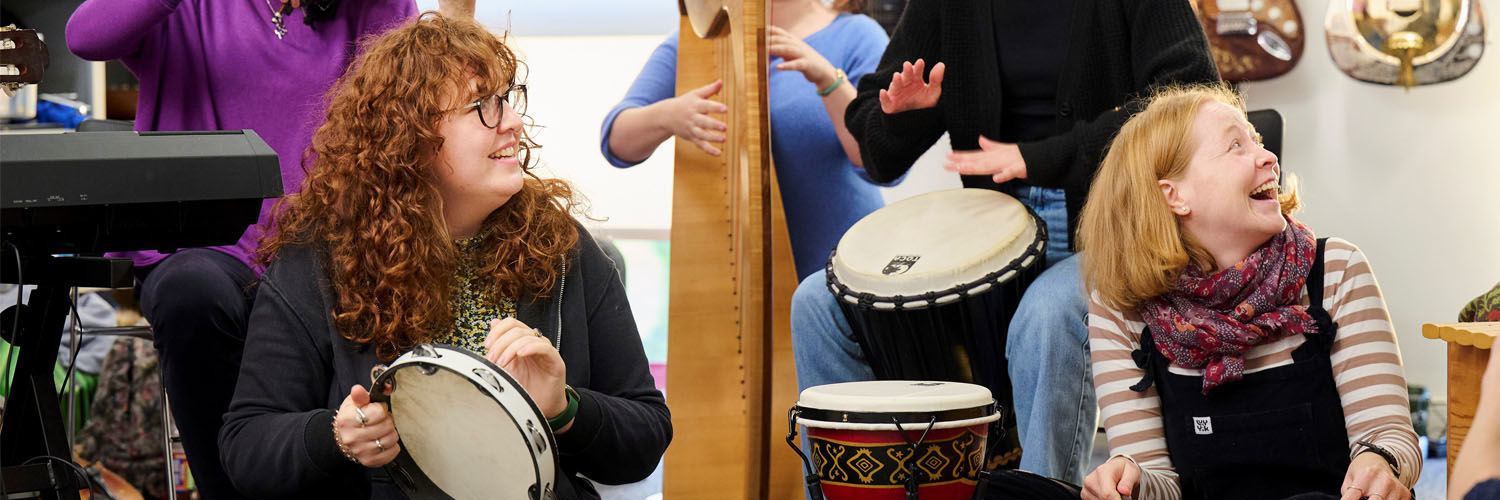 A group of people playing various instruments.