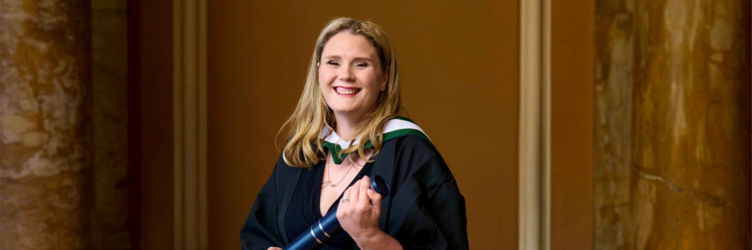 Aisling Thomas with scroll at QMU graduation