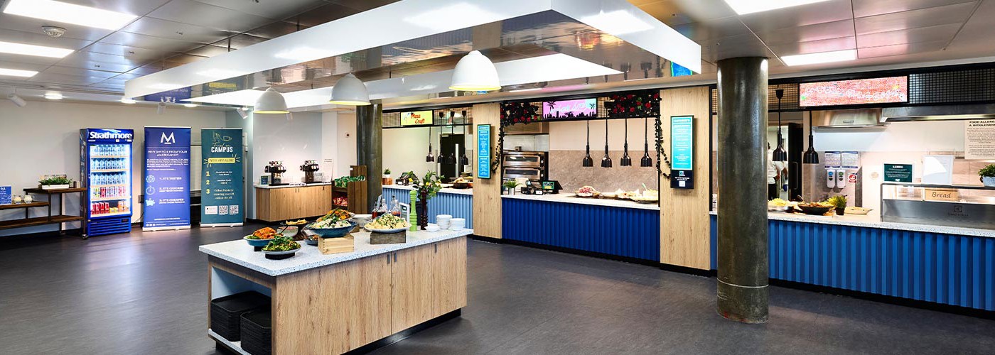 Guthrie's restaurant in Queen Margaret University, Edinburgh. In focus is the salad bar, filled with a variety of fresh ingredients.