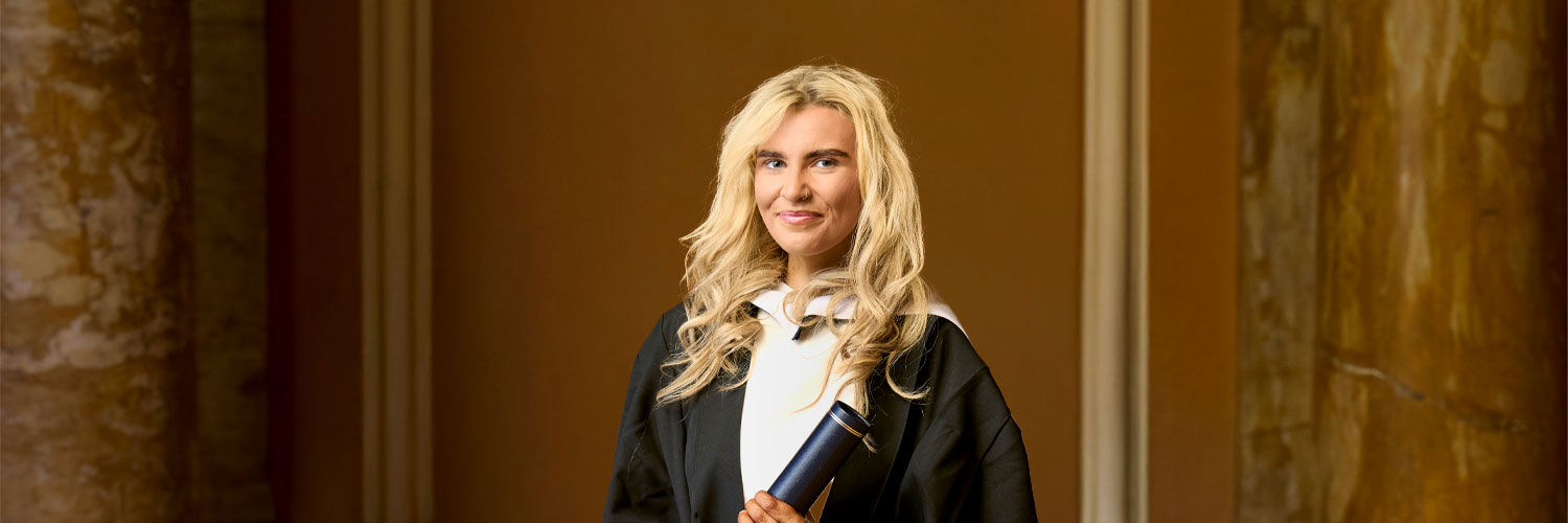 Kaleigh Doran in graduation robe