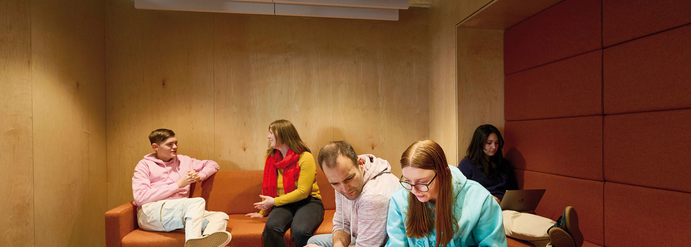 Image of different groups of students using cosy project room.