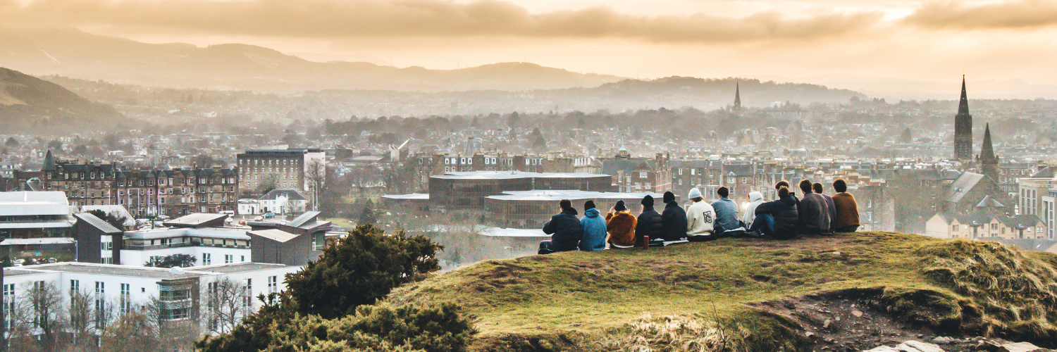 Students sitting on top of Arthur's Seat in Edinburgh (For MCO use only)