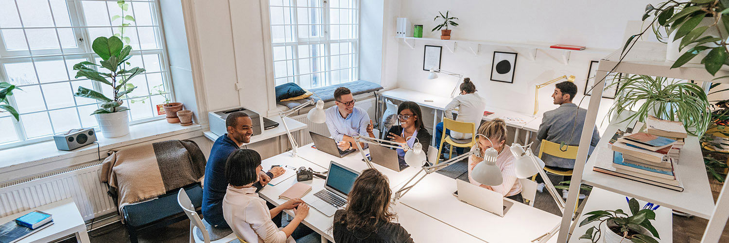 Group of creative people working together in a modern office