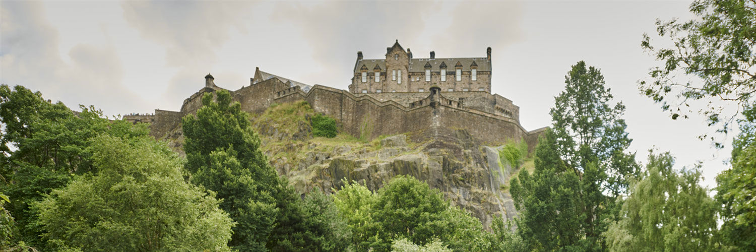 A view of Edinburgh Castle from below in Princes Street Gardens