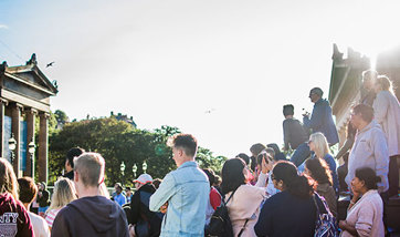 People watching street performance in Edinburgh 