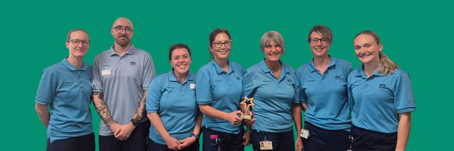 group line up of seven male and female physiotherapists in uniform