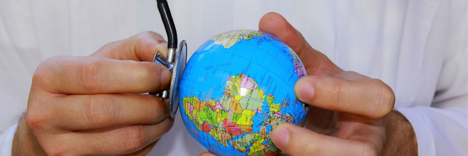 Hand holding a Globe