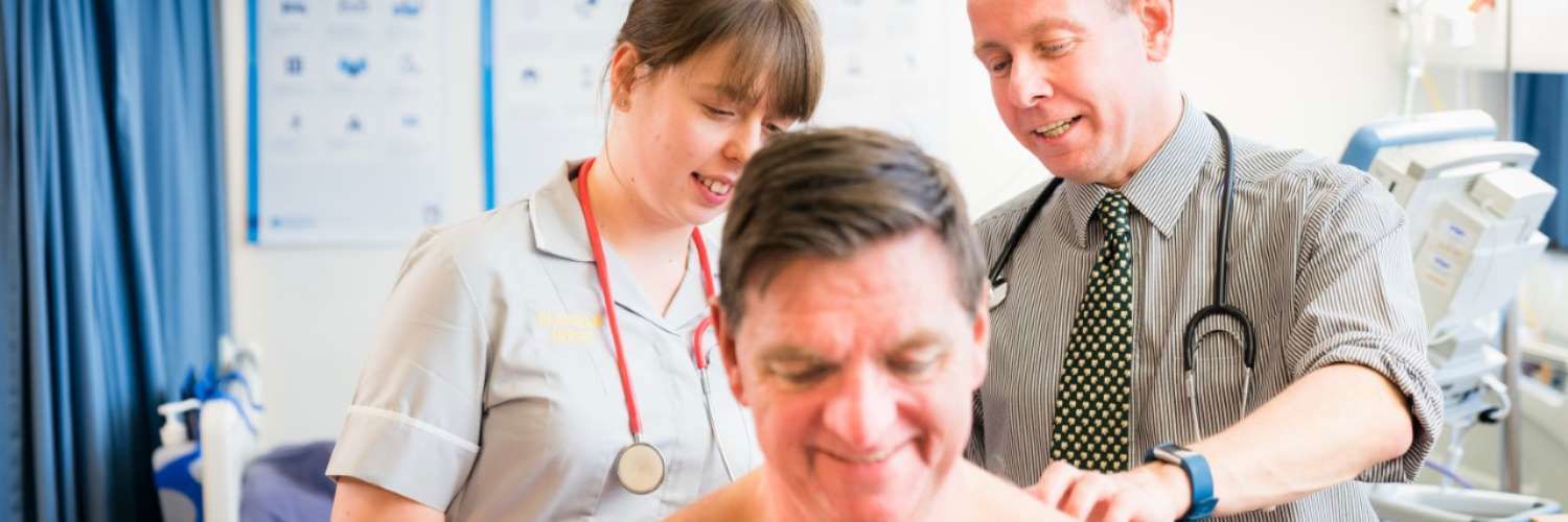 Image of Doctors examining patients back