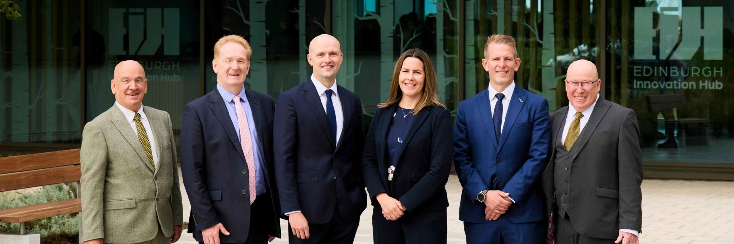 Line up of East Lothian Council, Edinburgh Innovation Hub, Scottish Government and Queen Margaret University officials at Edinburgh Innovation Hub