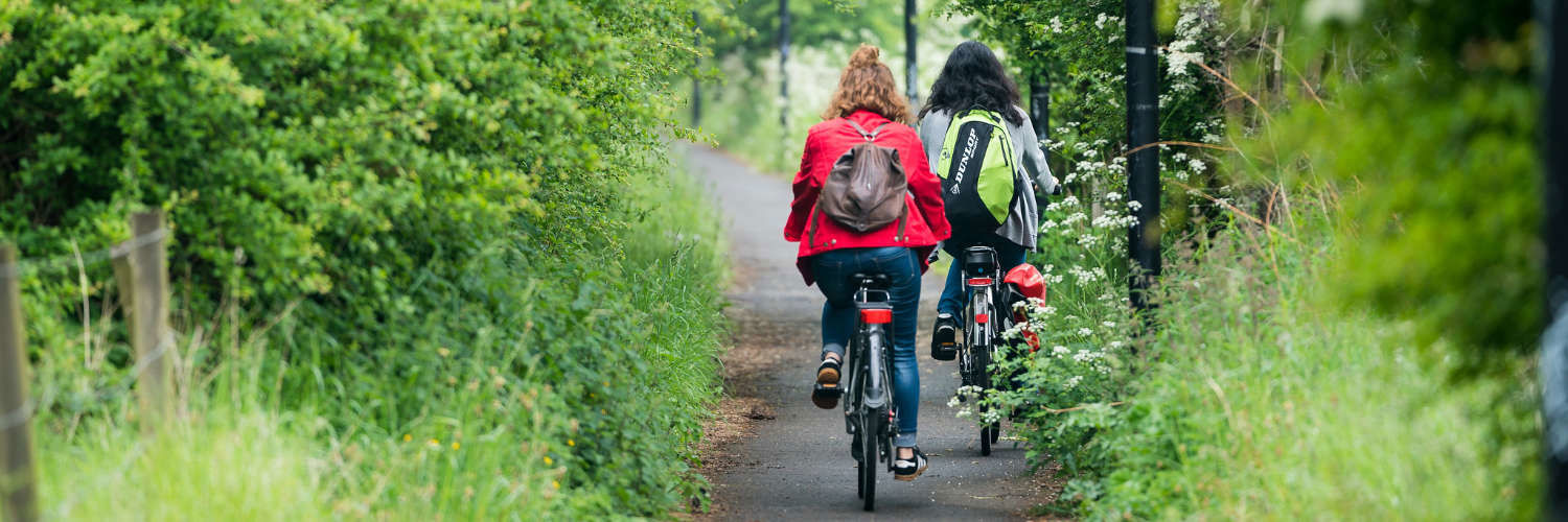 Friends cycling on Edinburgh cycle path