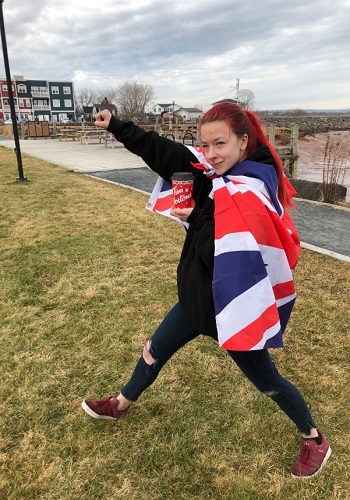 Image of Rebekka with Union Jack flag and Tim Hortons coffee