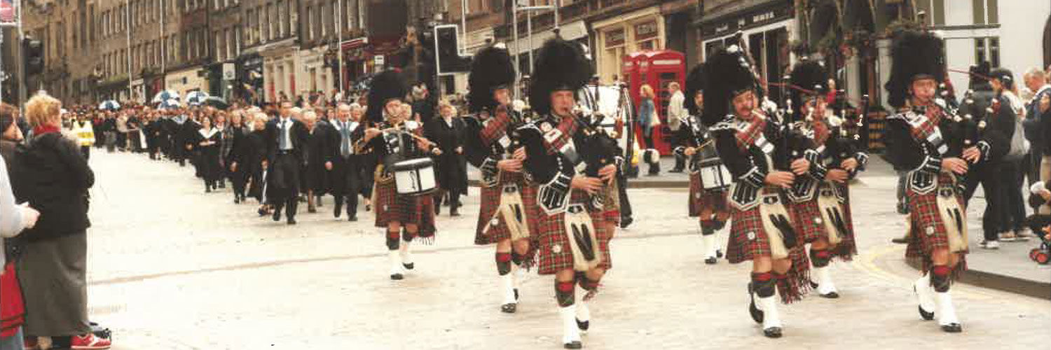 A group of pipers play as part of a procession down Edinburgh's Royal Mile to celebrate QMU's 125th anniversary.
