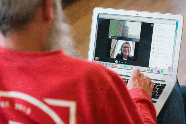 Man having an online discussion with colleagues or classmates