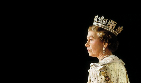 A side image of Her Majesty Queen Elizabeth II wearing a diamond crown and a white robe photographed on a black background