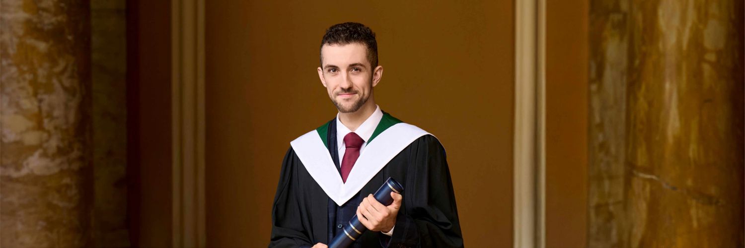 Joe Agnew with scroll at QMU Graduation