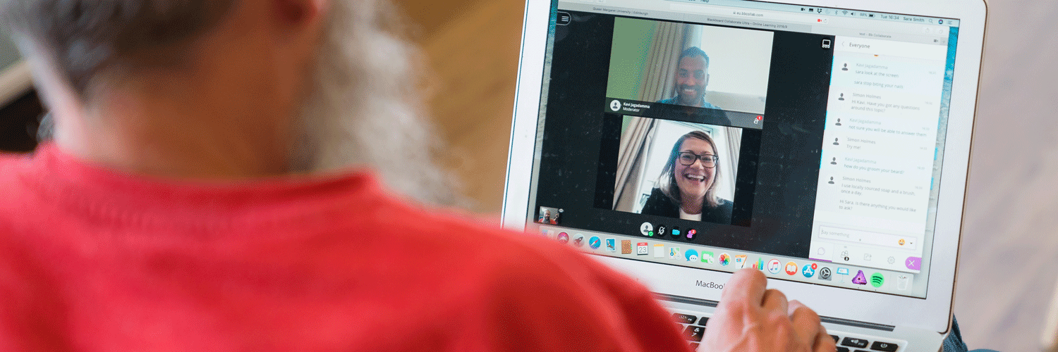 Man having an online discussion with colleagues or classmates